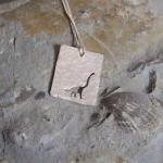 Silver Dinosaur pendant: A ..