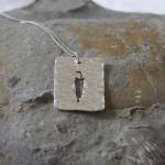 Stalking cat pendant: A cat..