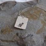 Silver cat pendant: A cat s..
