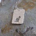Silver cat pendant: A cat s..