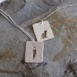 Silver cat pendant: A cat s..