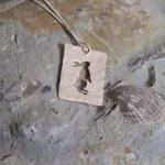 Silver rabbit pendant: A Cu..