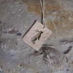 Silver rabbit pendant: A Cu..