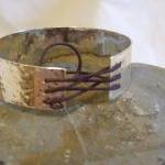 Silver textured bracelet wi..