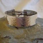 Silver textured bracelet wi..