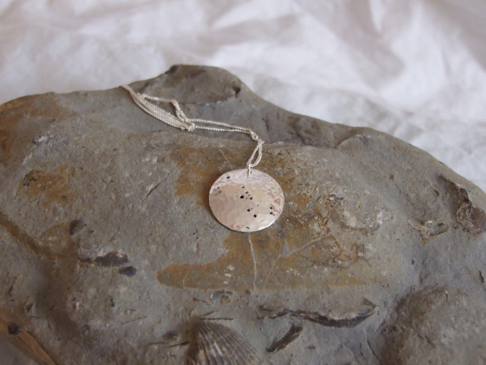 Silver Taurus pendant: The constellation of Taurus on a textured sterling silver pendant