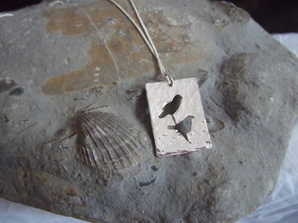 Silver Birds pendant: A beautiful silhouette of two love birds on a branch in sterling silver.