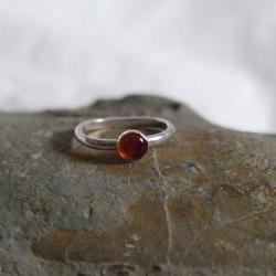 Silver Amber Ring: A beautiful sterling silver ring with a bezel set Amber stone.
