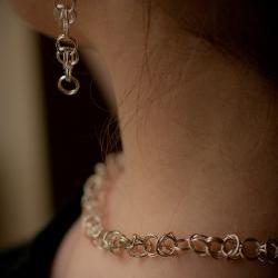 Clip-on Silver earrings: A pair of sterling silver byzantine chain maile earrings with each link soldered.