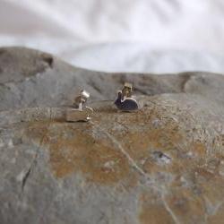 Silver Rabbit earrings: A pair of Bunny shaped sterling silver earrings.